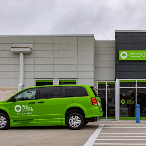 An Oak Street Health van parked outside the Carrollton primary care clinic in Carrollton, Texas.