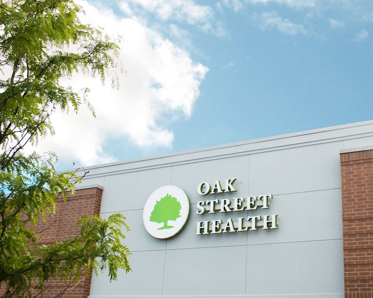 The Oak Street Health sign on the exterior of the Englewood primary care clinic in Chicago, Illinois.