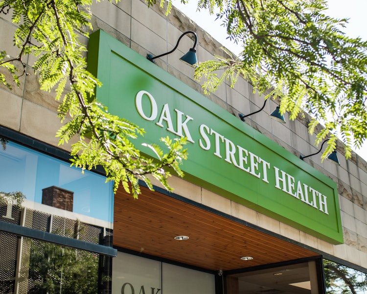 The Oak Street Health sign on the exterior of the Edgewater primary clinic in Chicago, Illinois.