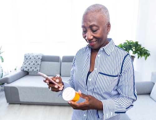 older woman reviewing her medication label