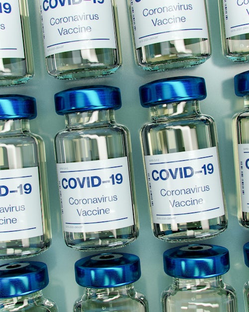 close up shot of covid-19 vaccine bottles