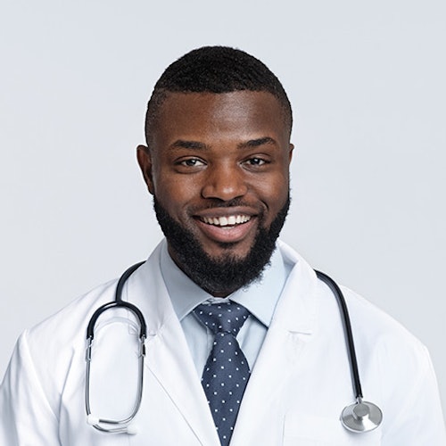 A headshot of a doctor smiling.