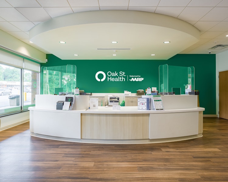 The welcome desk and reception area at an Oak Street Health clinic.