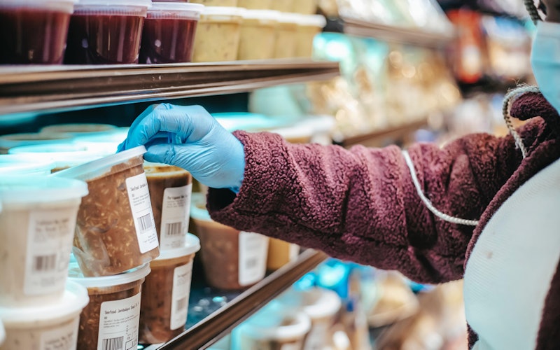 woman choosing frozen product in super market