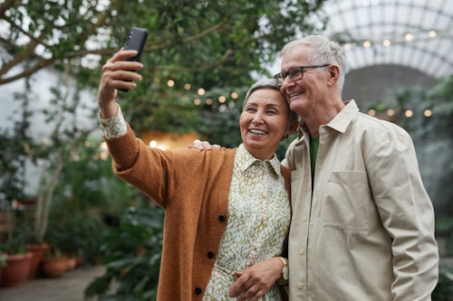 Couple Smiling While Taking a Selfie