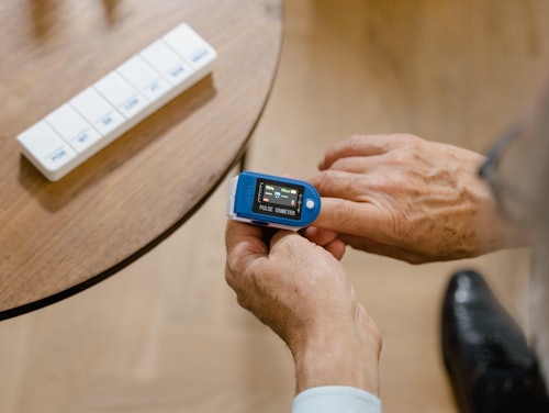 An Elderly Person Checking His Blood Oxygen Level