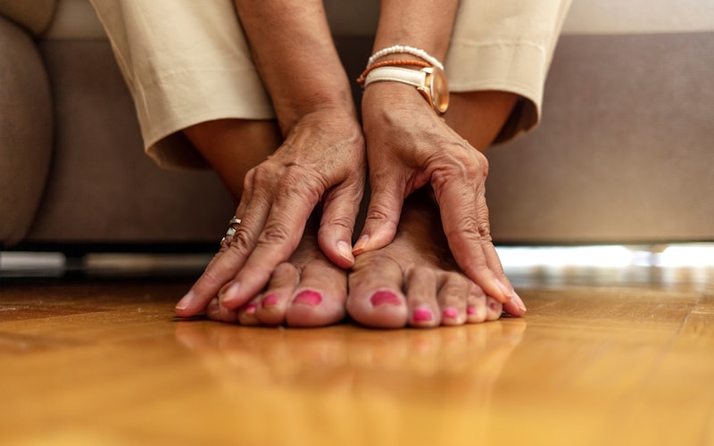 Woman massaging the top of her feet