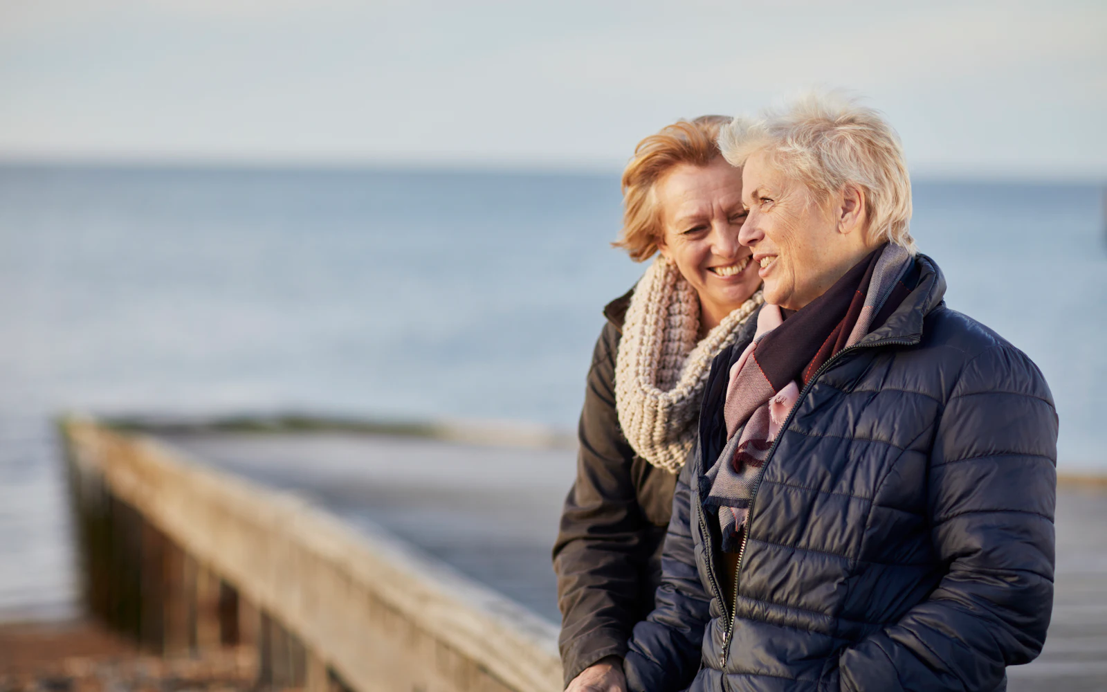 couple standing outside on pier