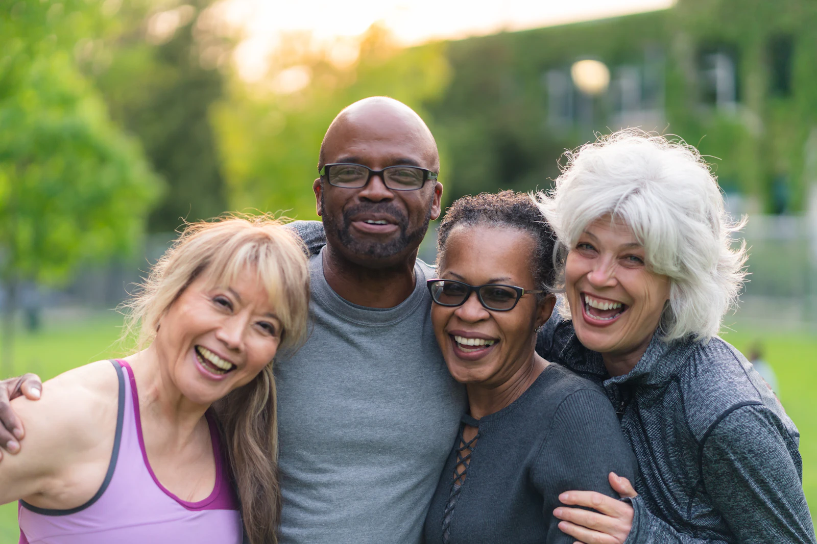 Older adults smiling outside in park