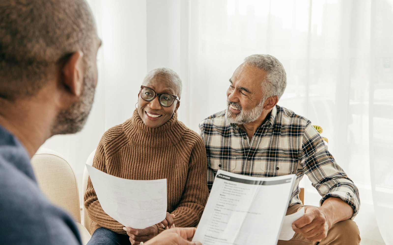 couple discussing paperwork with provider