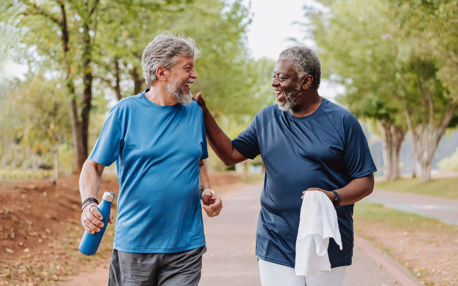 men running in park together