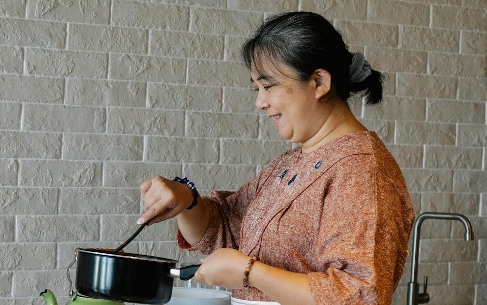 older woman cooking in her kitchen