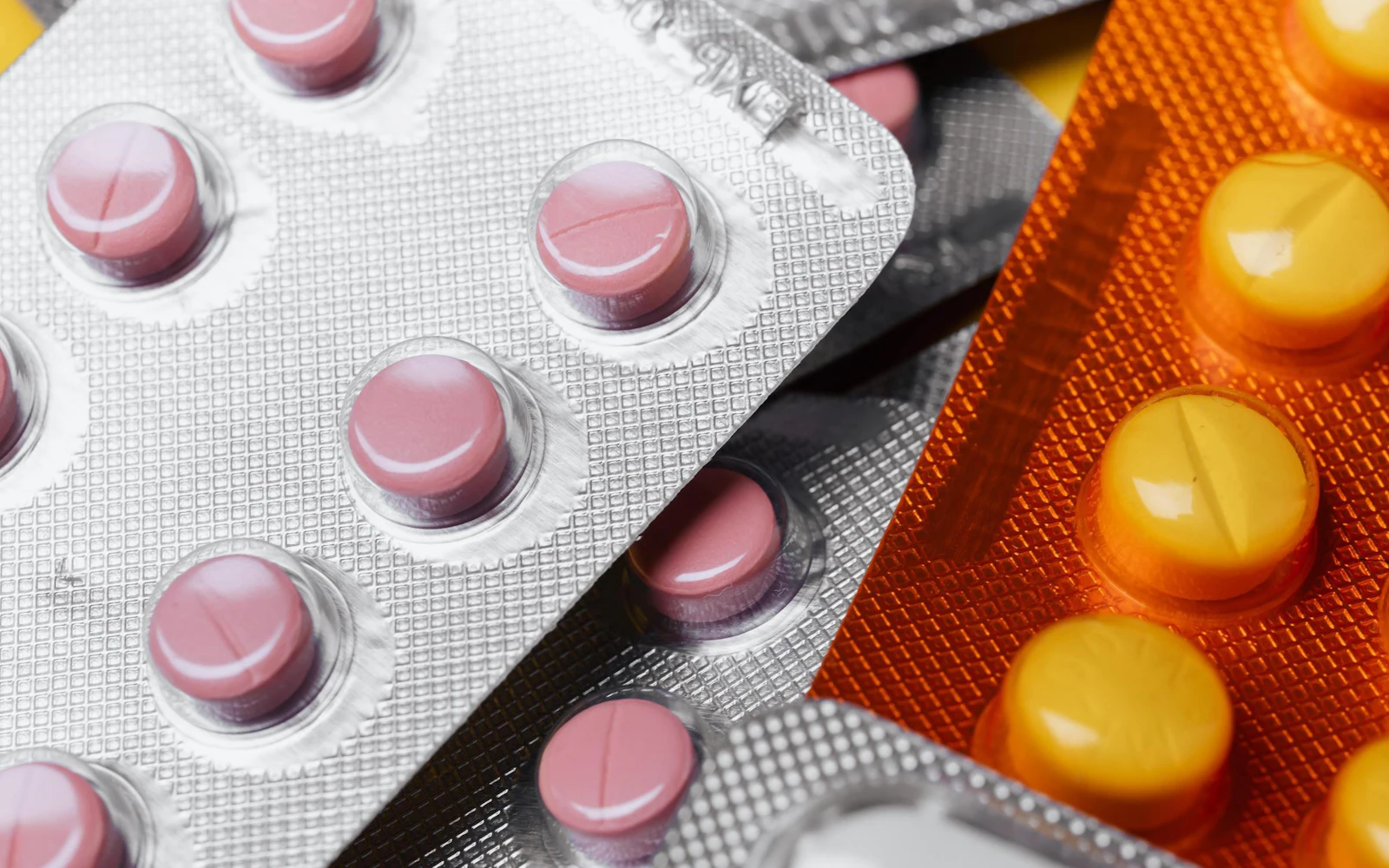 Close-up of a stack of pills in blister packs.