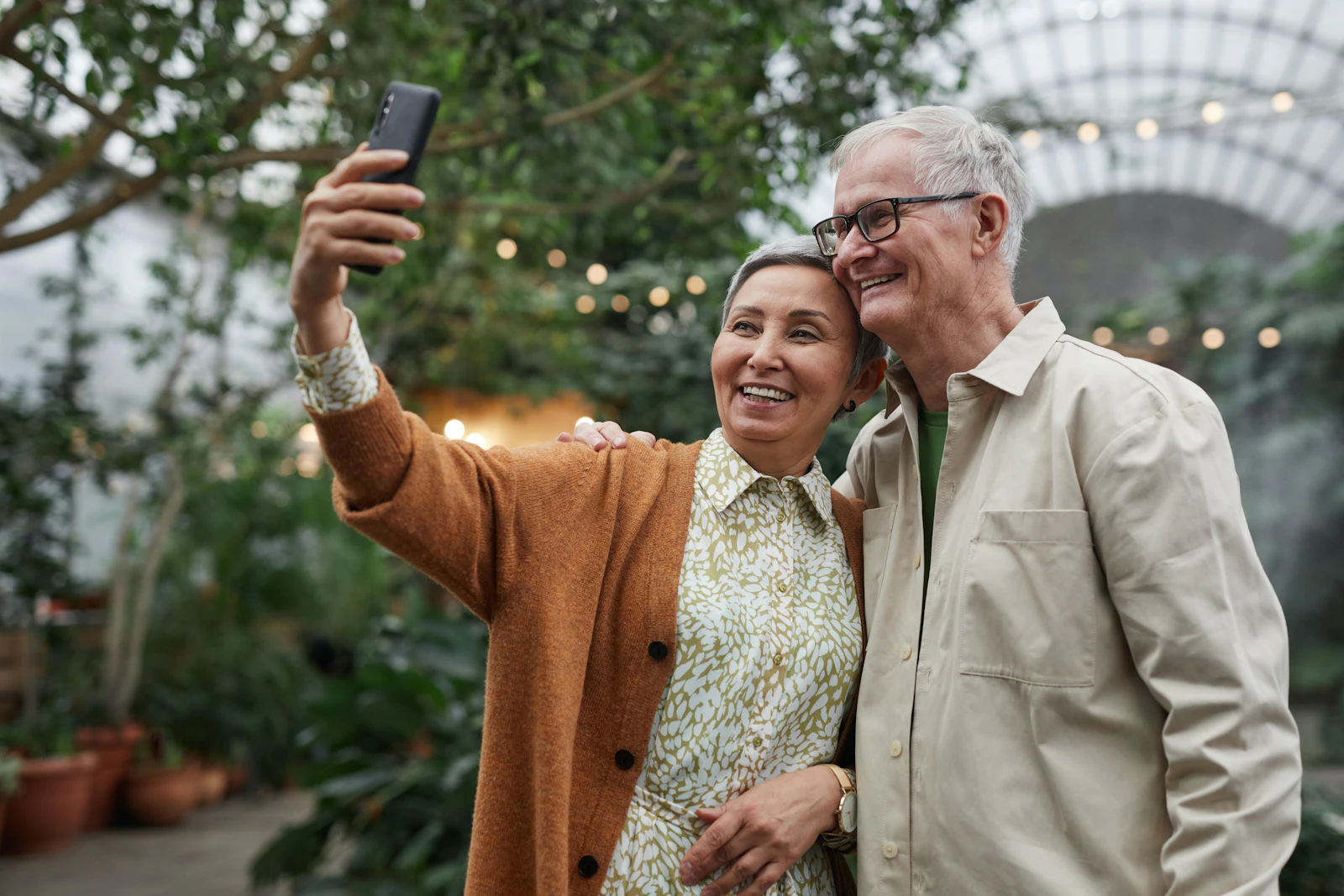 Couple Smiling While Taking a Selfie